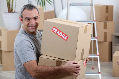 Professional removal team loading furniture for a Stamford Hill move