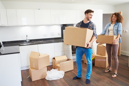 Organised moving day with boxes and furniture in transit