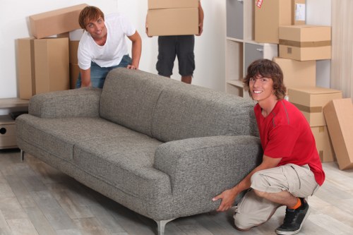 Professional movers unloading commercial items at a Stamford Hill property
