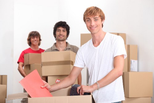Packed business equipment ready for transport during a commercial relocation