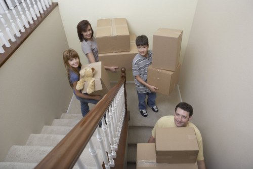 Packed moving boxes and household items ready for transport in Stamford Hill